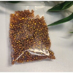 Czech Glass Beads 10/0 Preciosa Brand.  Amber Brown Crystal Color. Bag  15 Gr.